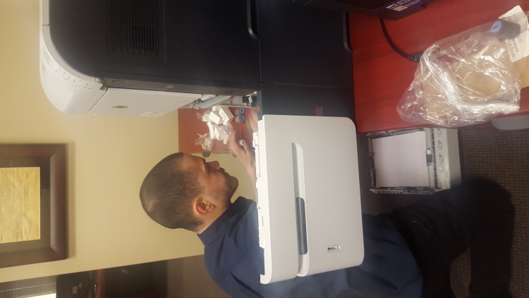 Service technician repairing a copier in las vegas