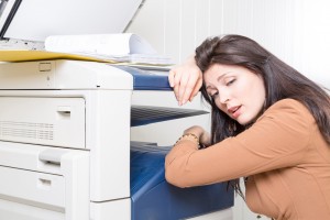 woman frustrated with head on copy machine in need of Copier repair in Las Vegas